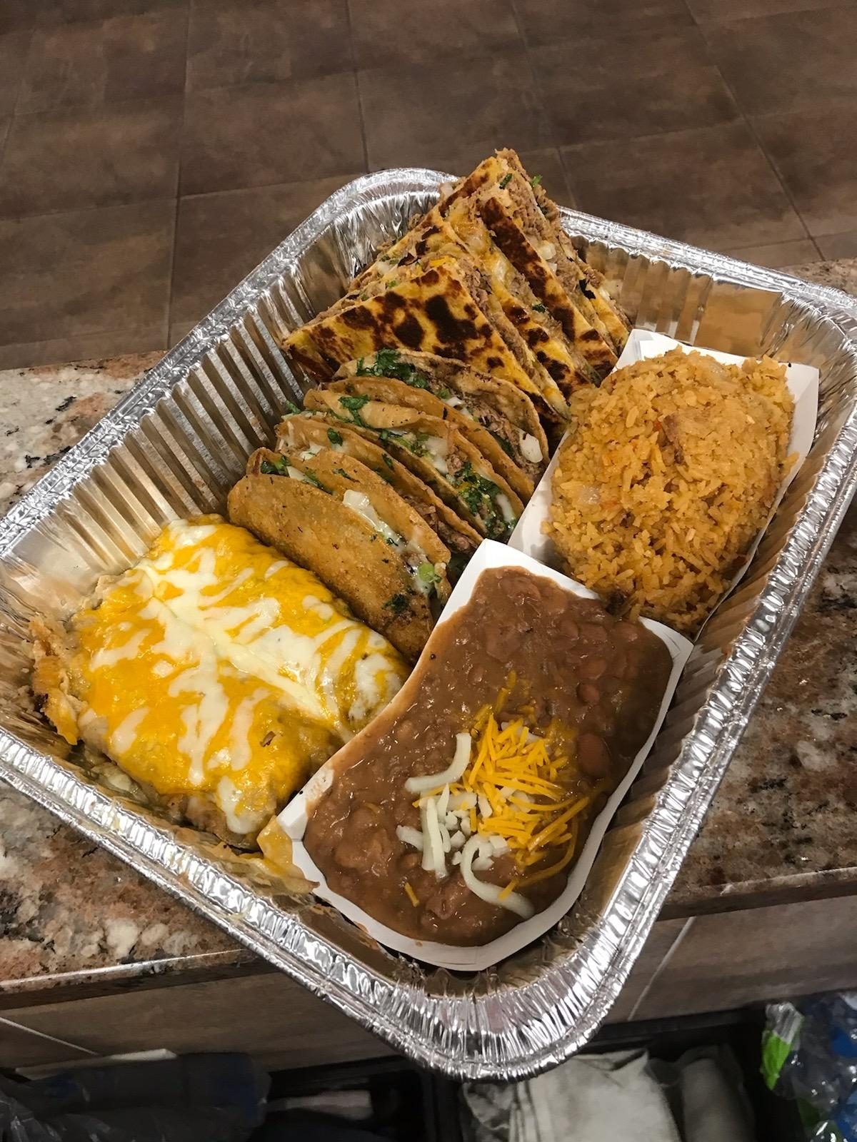 The Sampler - 2 Tacos, 2 Quesadillas, 2 Enchiladas with Sides.